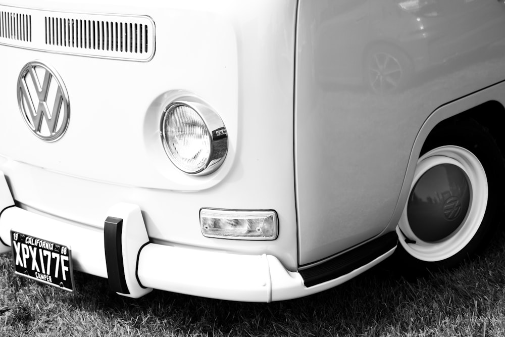white volkswagen beetle on black and white surface