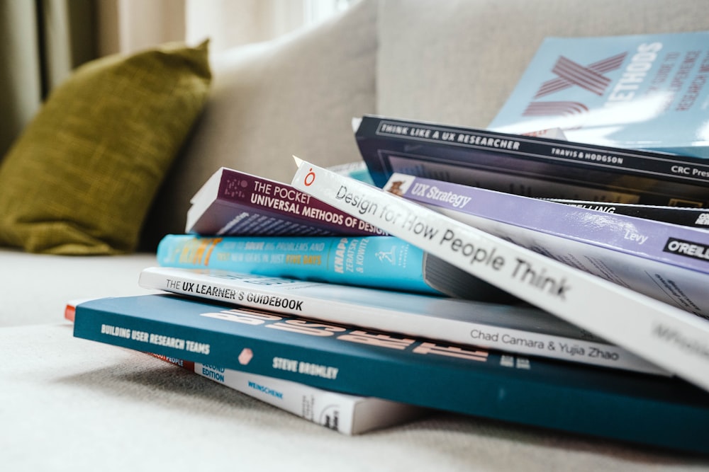 stack of books on white table