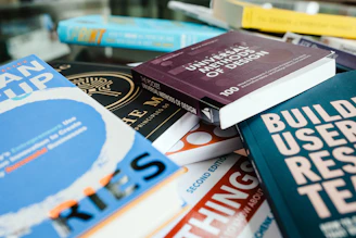 red and blue book on white shelf