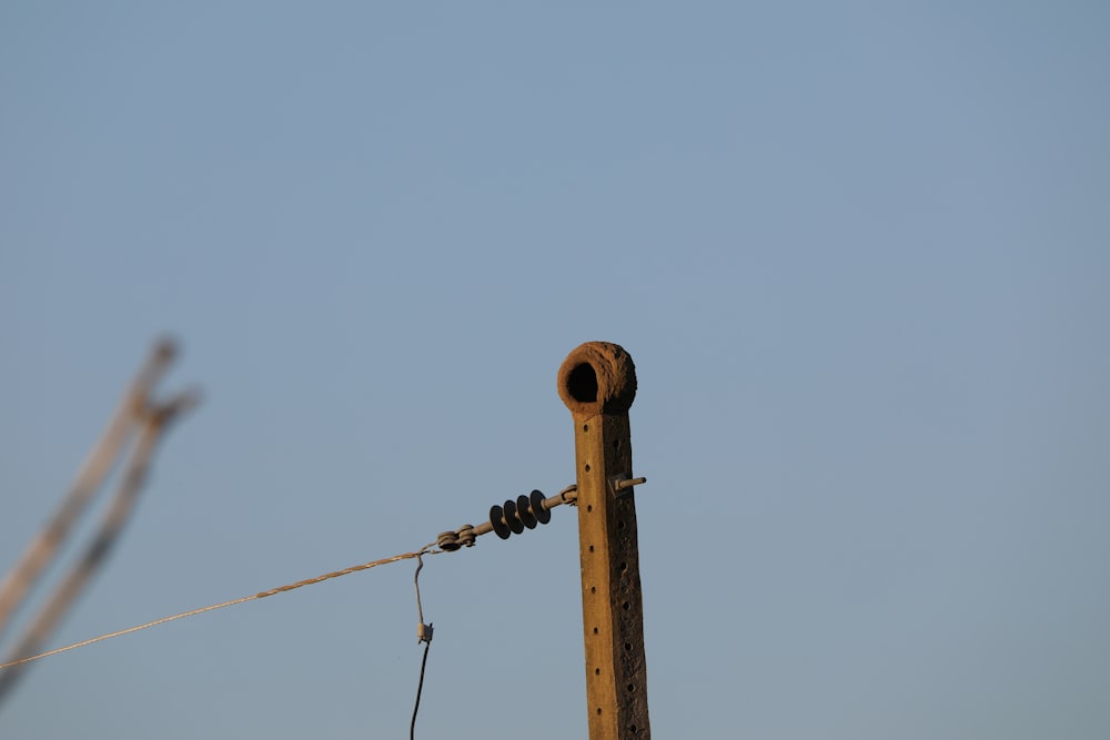 brown steel pipe under white sky during daytime