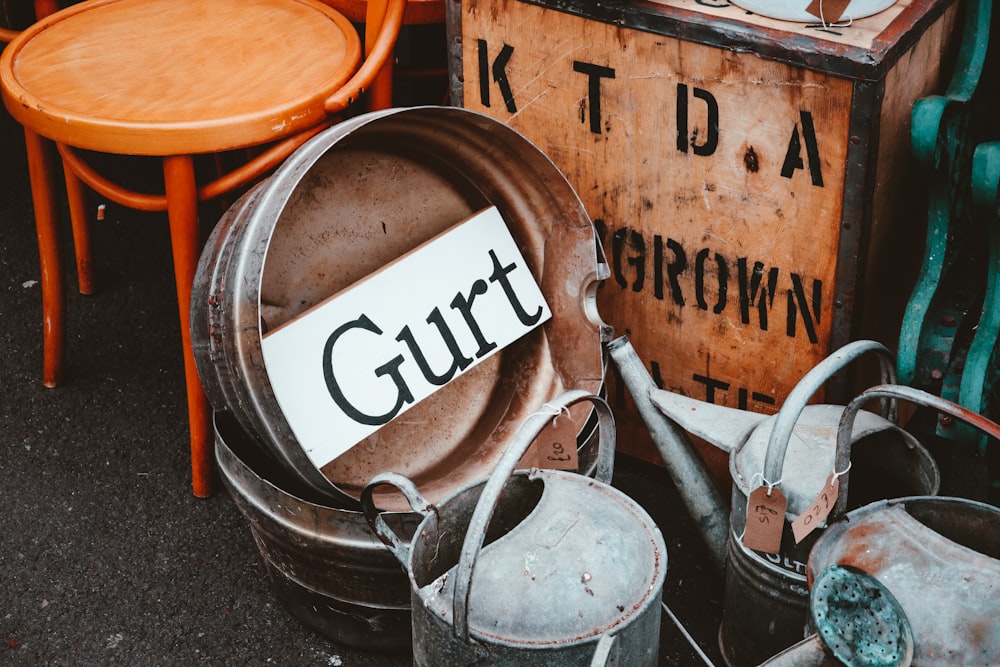 brown wooden barrel with white and black paint