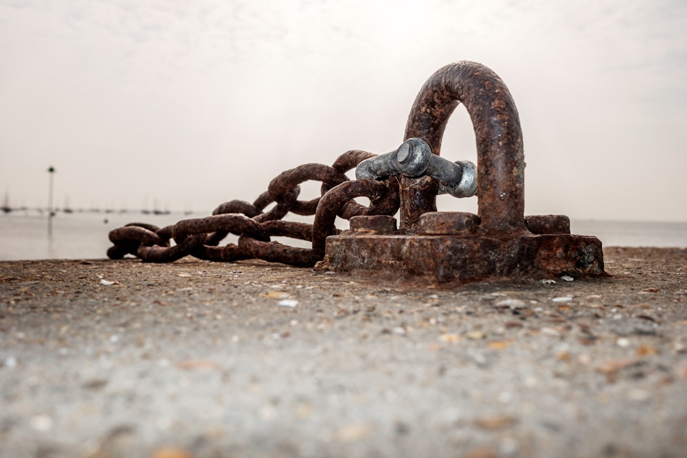 black metal chain on brown concrete floor