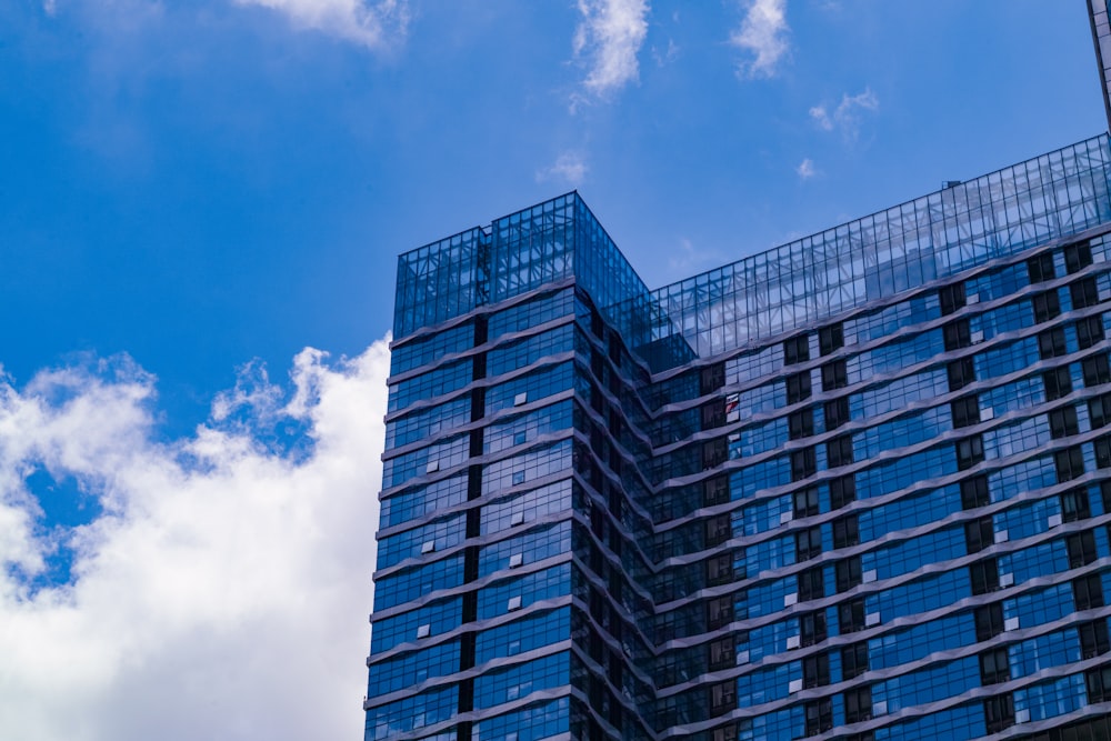 blue and white concrete building under blue sky during daytime