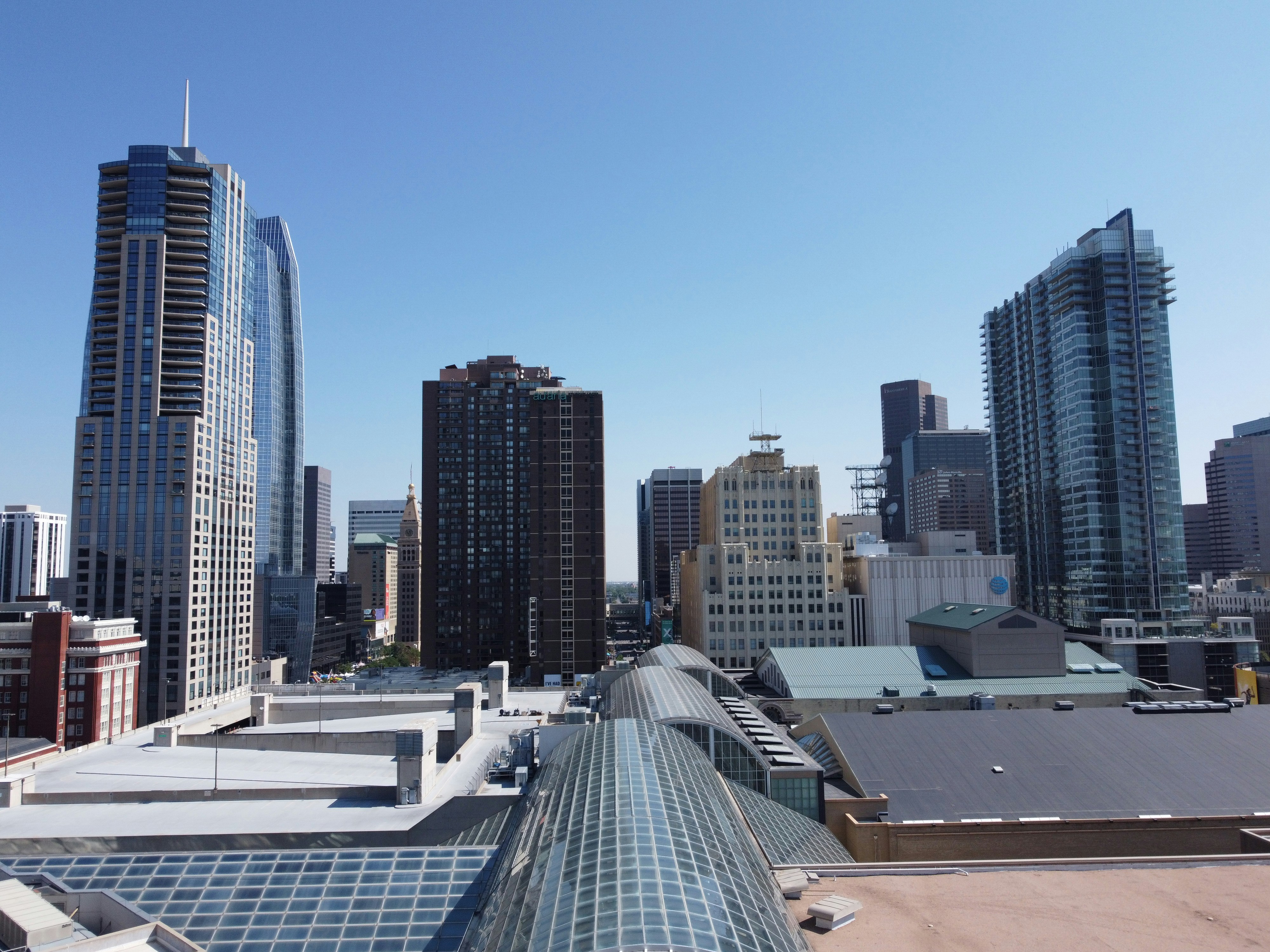 high rise buildings under blue sky during daytime, Bellco Theatre at the Colorado Convention Center