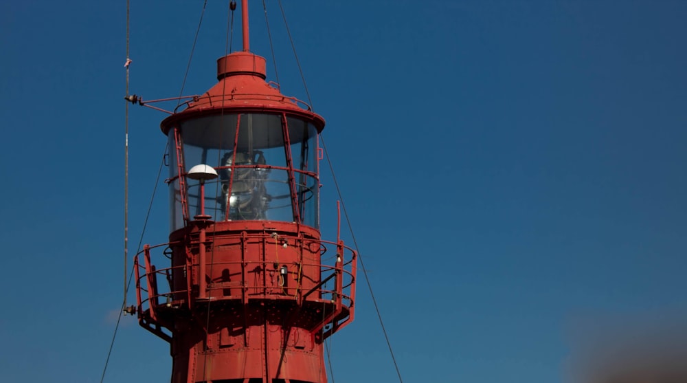 red and white tower under blue sky during daytime