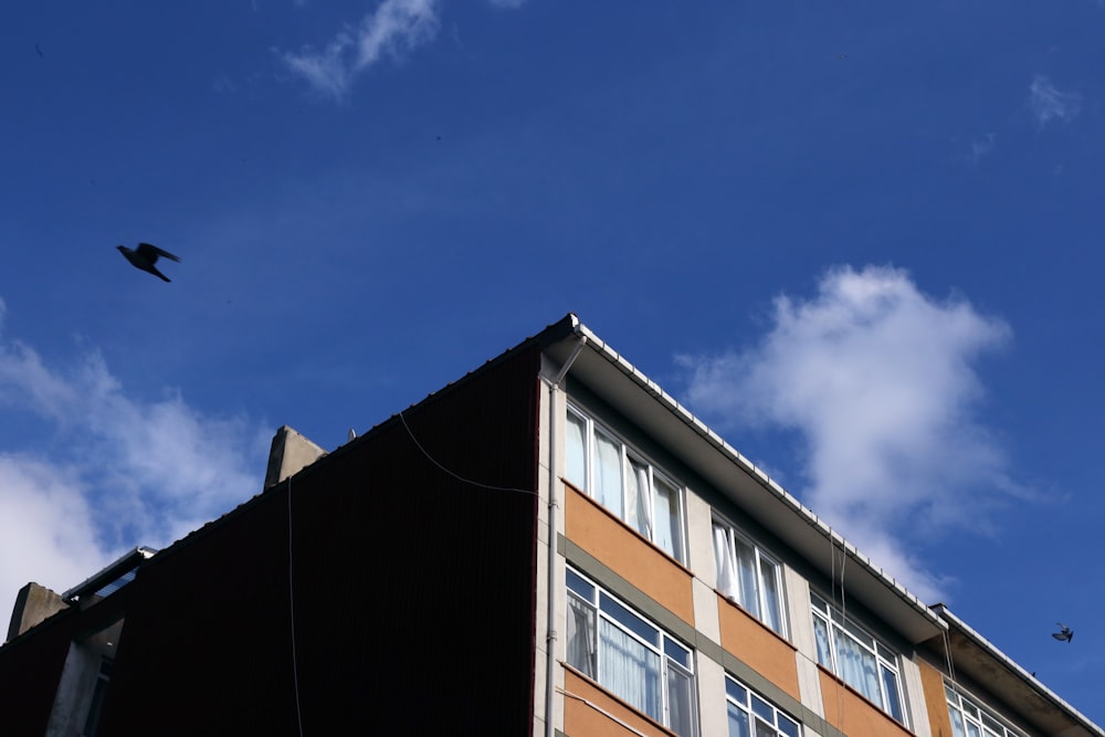 brown concrete building under blue sky during daytime