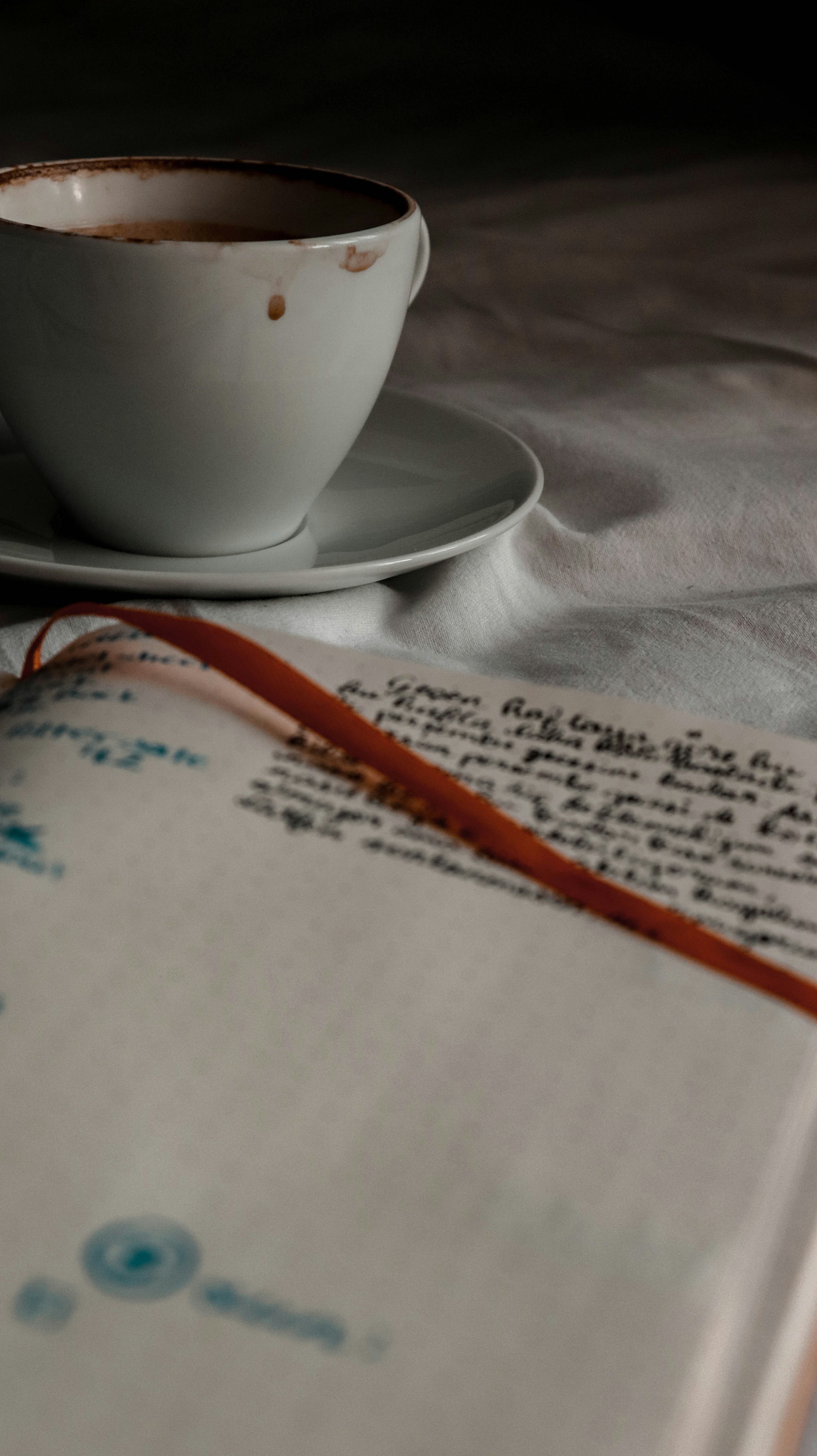 white ceramic mug on white ceramic saucer