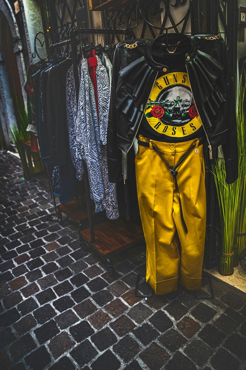 a yellow wetsuit hanging on a rack in a store