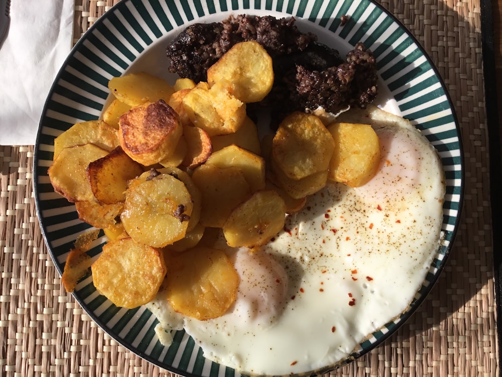 fried food on blue and white round plate