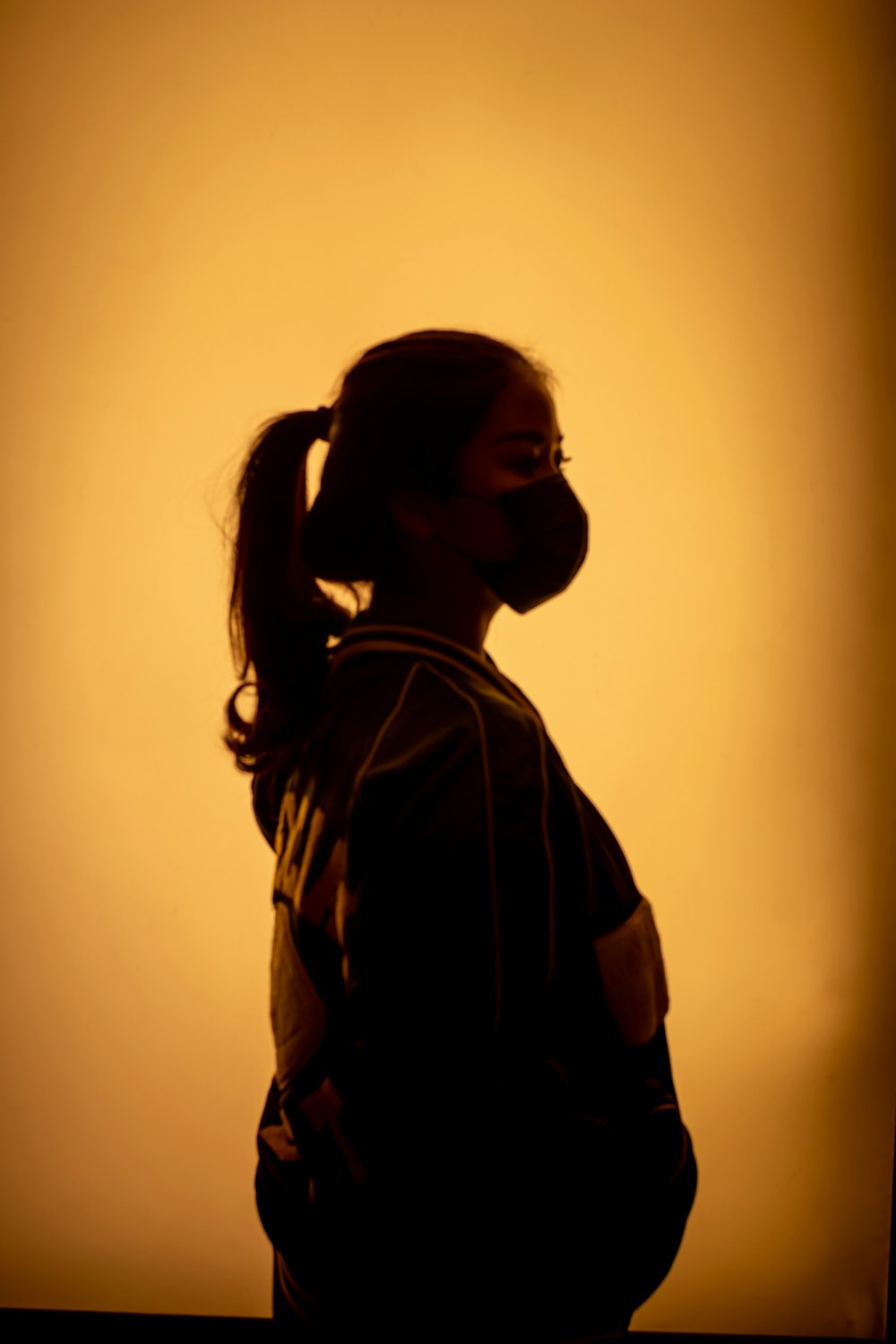 woman in black jacket wearing black sunglasses