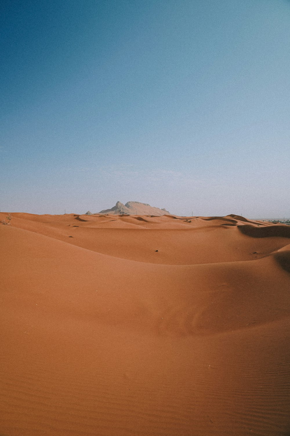 brown sand under blue sky during daytime