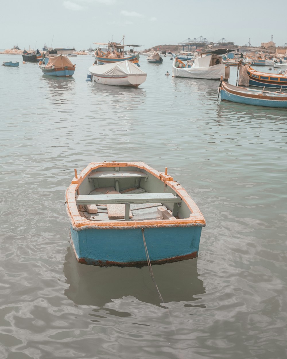 blue and brown boat on water during daytime