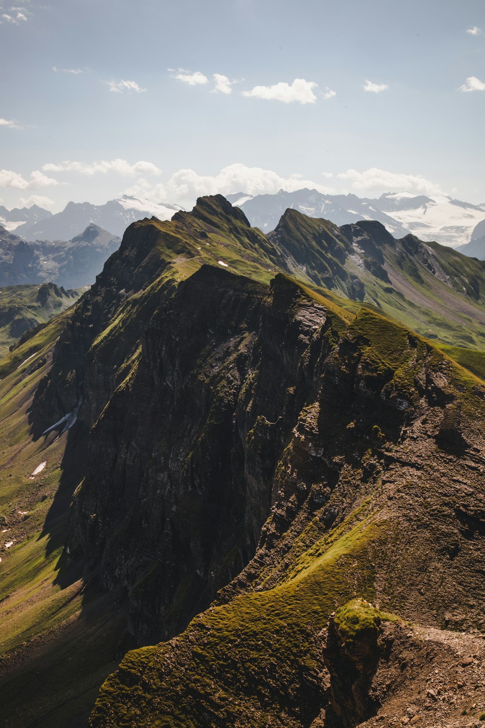 green and brown mountain under white sky during daytime