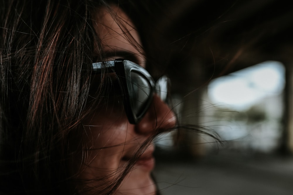 woman wearing black framed sunglasses