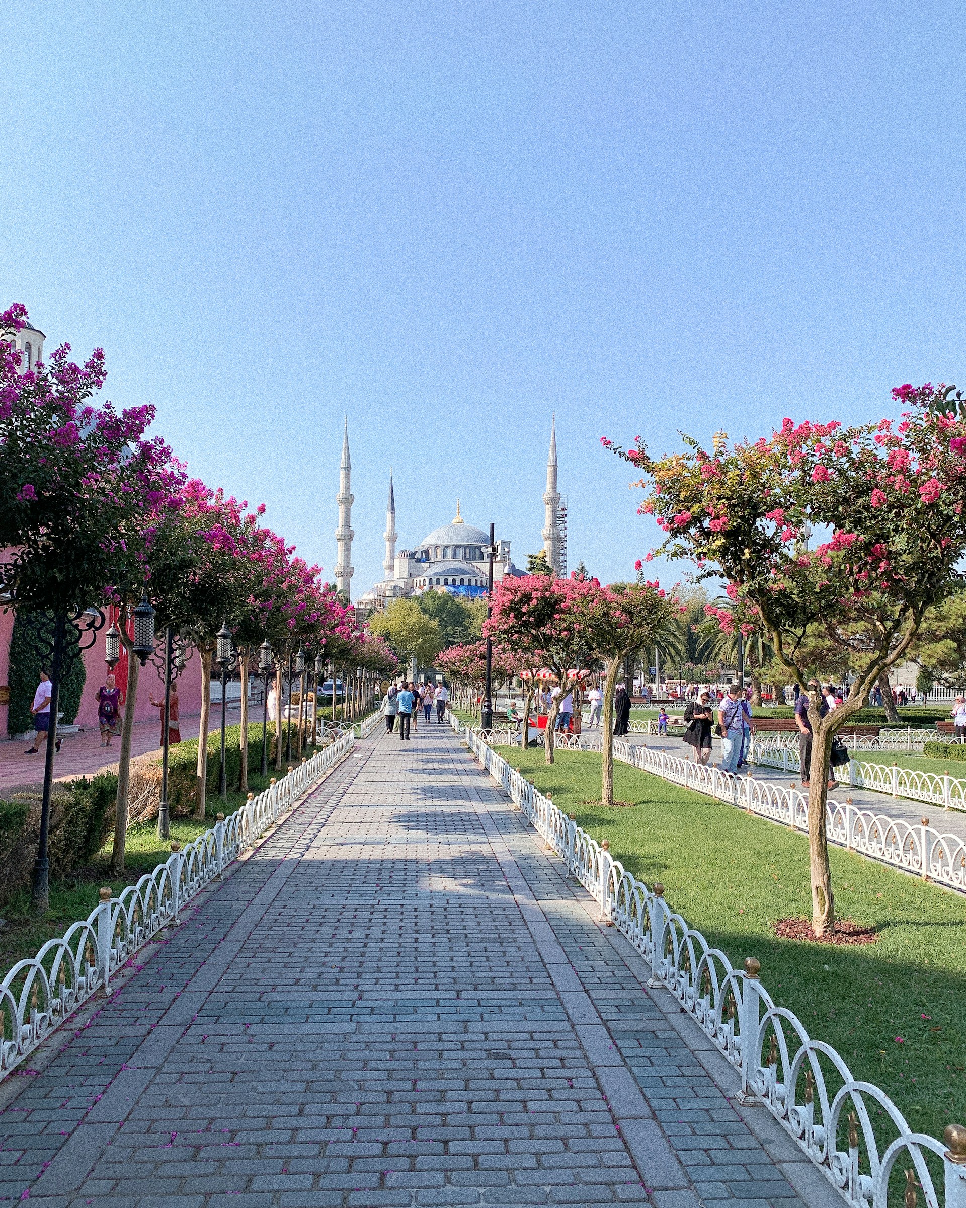 woman wearing yellow long-sleeved dress under white clouds and blue sky during daytime