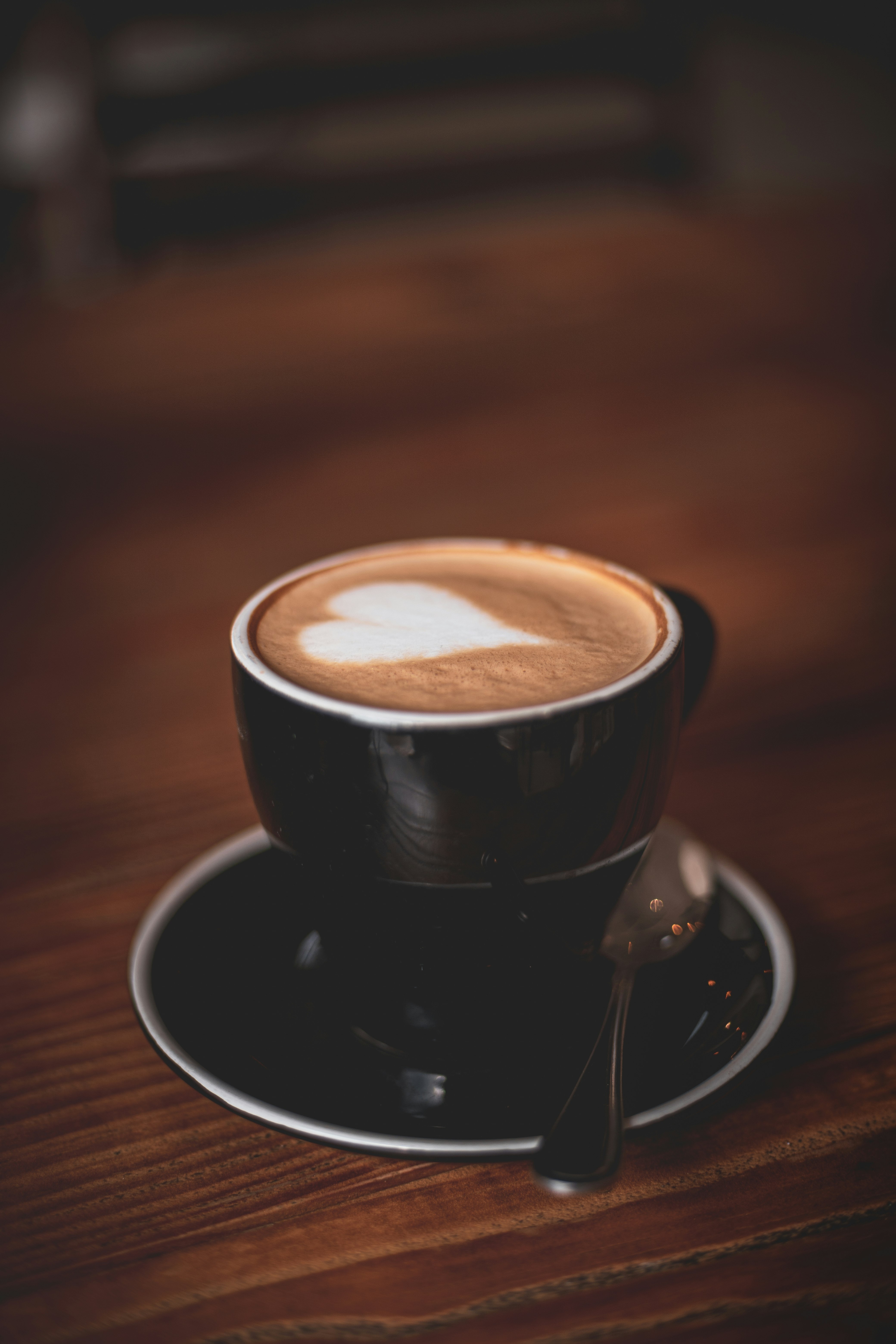 black ceramic cup on saucer