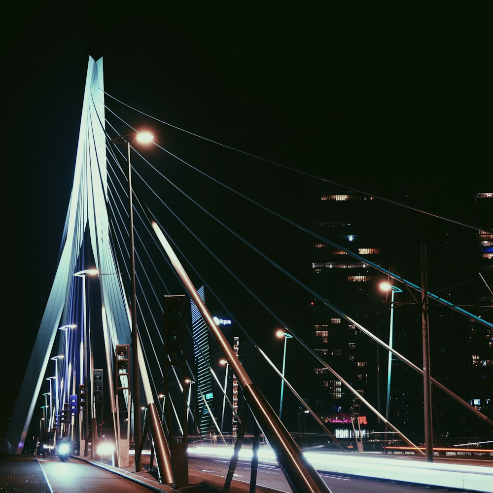 cars on bridge during night time