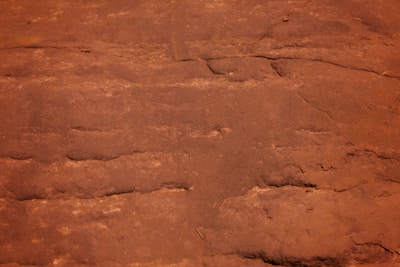 Furniture pieces showcasing unique textured finishes in warm, earthy tones.