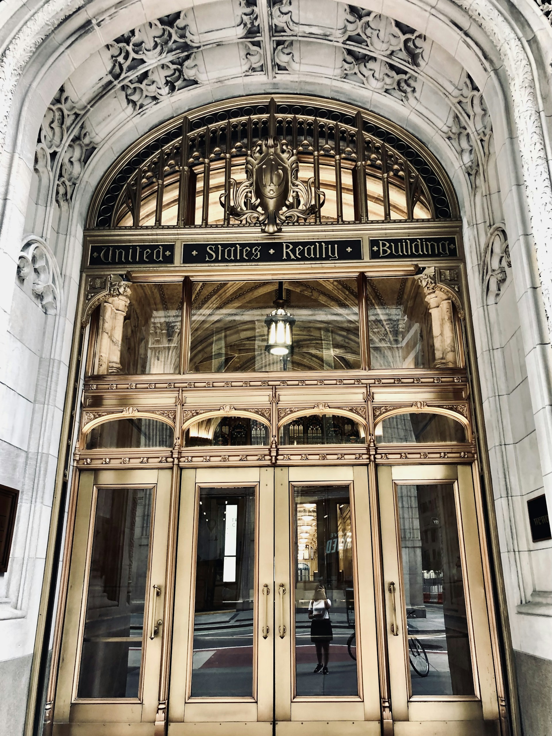 woman wearing yellow long-sleeved dress under white clouds and blue sky during daytime
