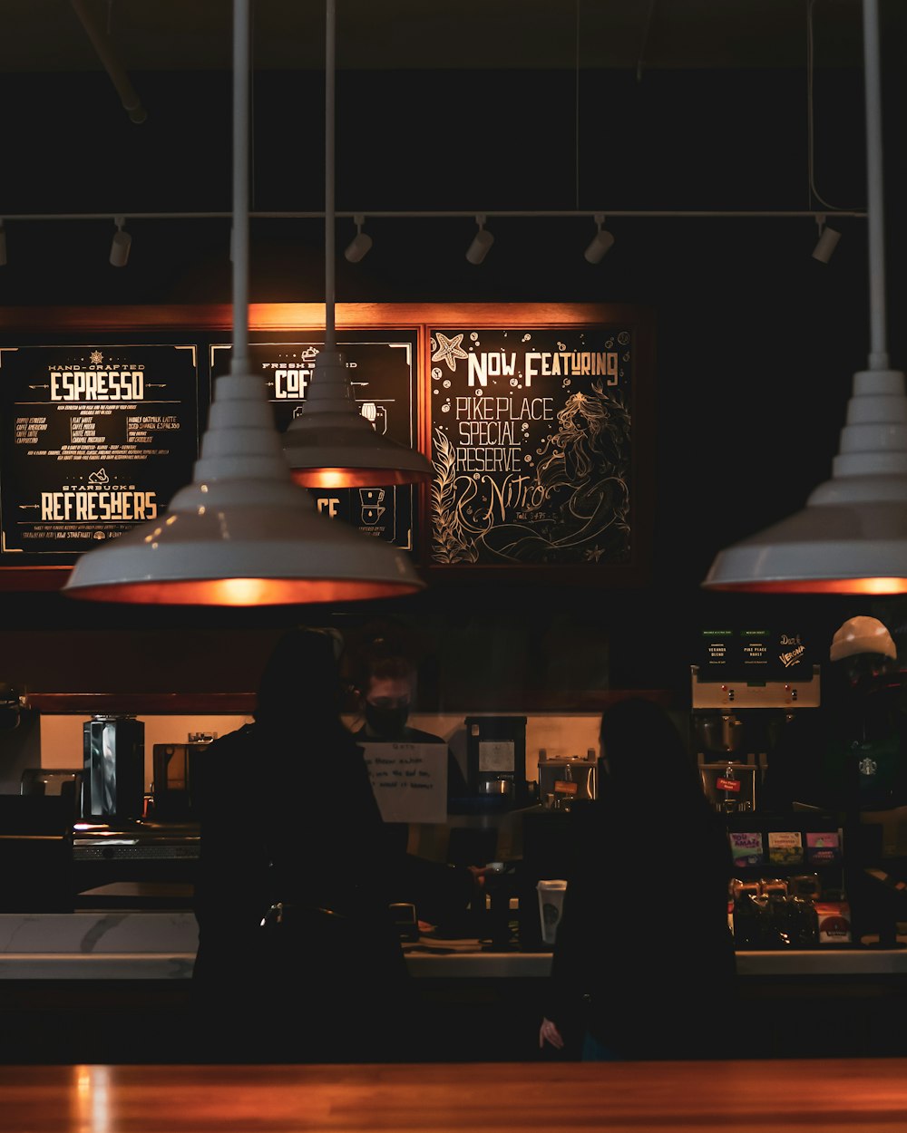 people standing in front of store during night time