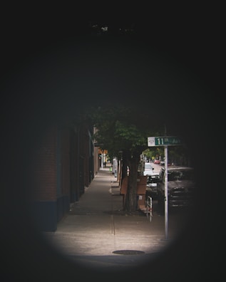 Street-level perspective of the entrance to 14th Avenue with landscaped pathways.