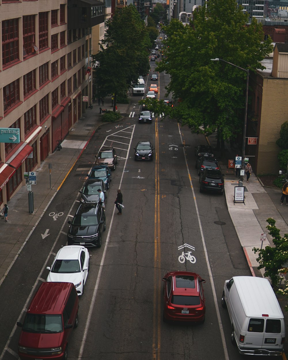 red car on the road during daytime