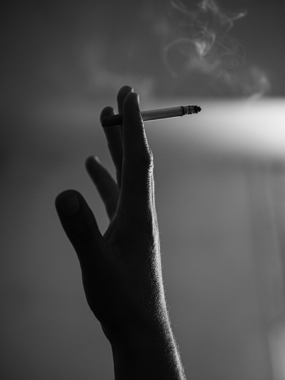 grayscale photo of person smoking