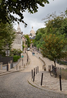 Street leading up to the Sacré-Cœur Basilica in Montmartre for a guided walking tour of the hill