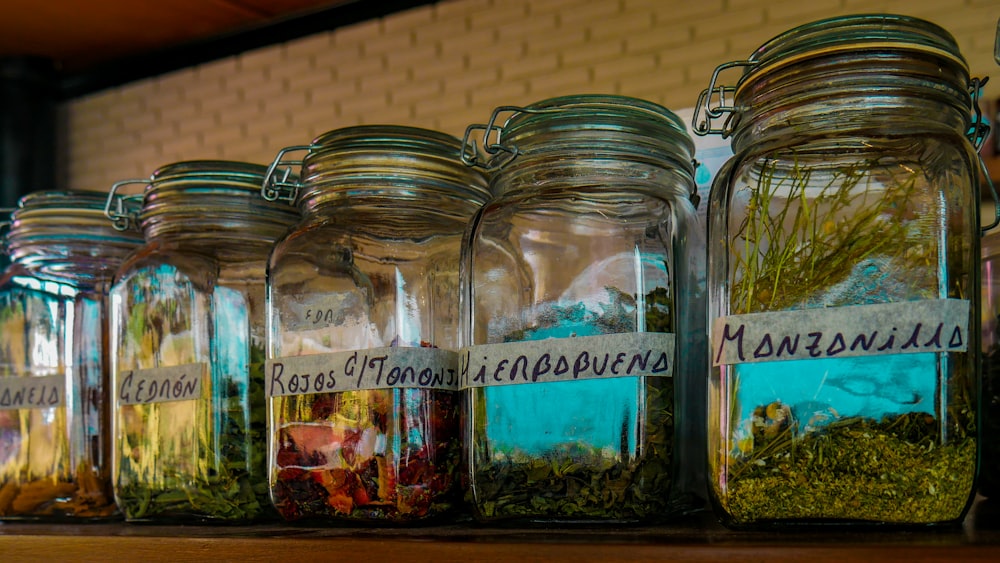 clear glass jars with assorted spices