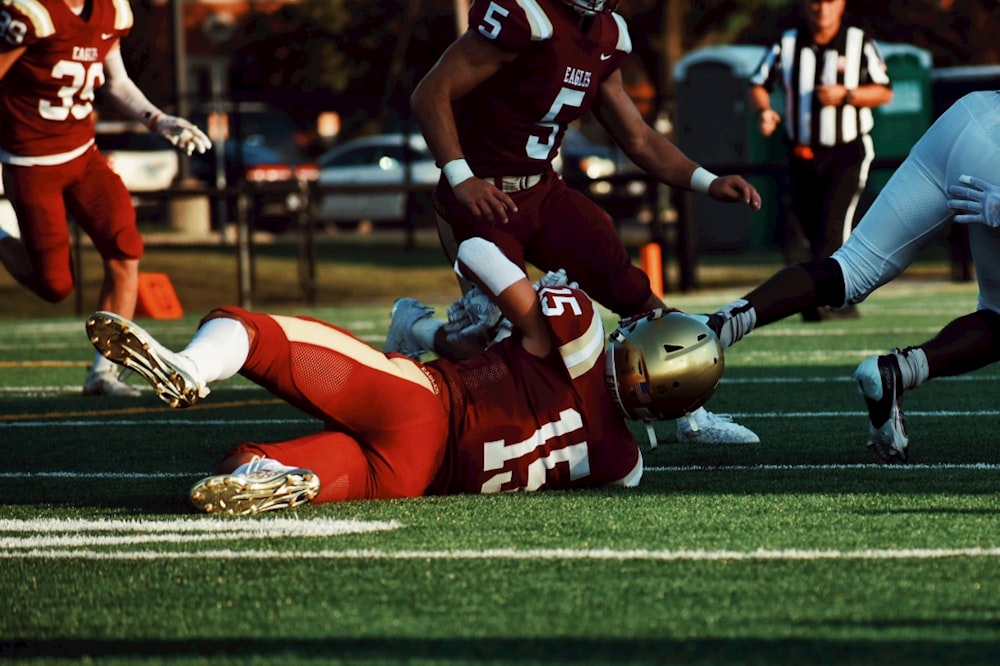 football players on field during daytime