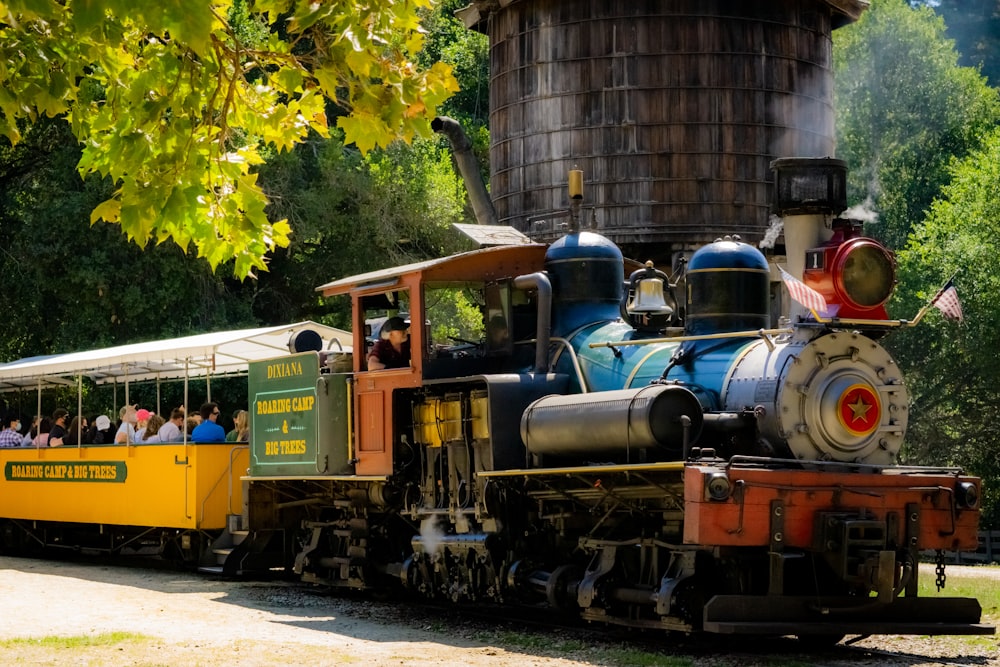 black and brown train on rail tracks during daytime