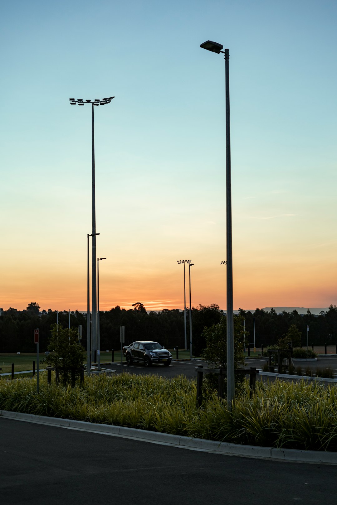 cars parked on parking lot during sunset