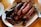 fried sausage on white ceramic plate