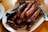 fried sausage on white ceramic plate