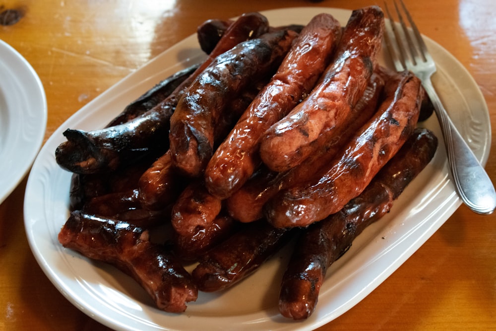 fried sausage on white ceramic plate