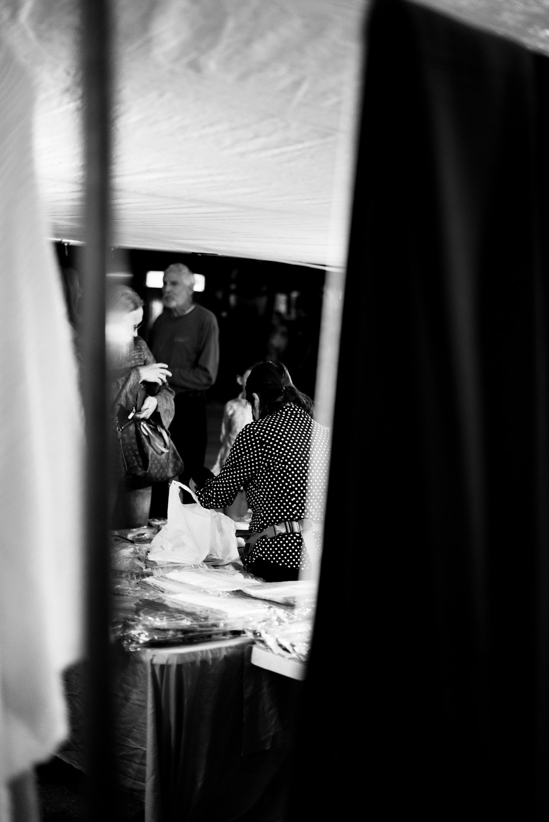 grayscale photo of people in a train station