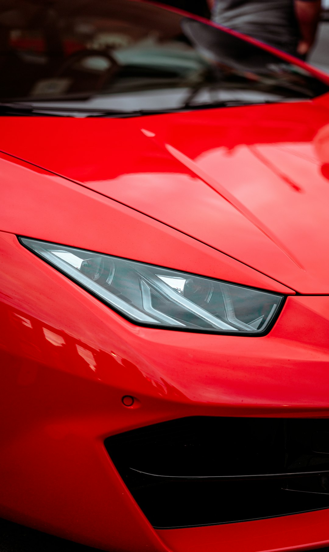 red ferrari car in close up photography