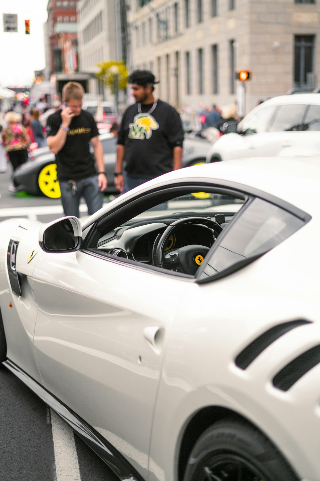 white porsche 911 parked on street