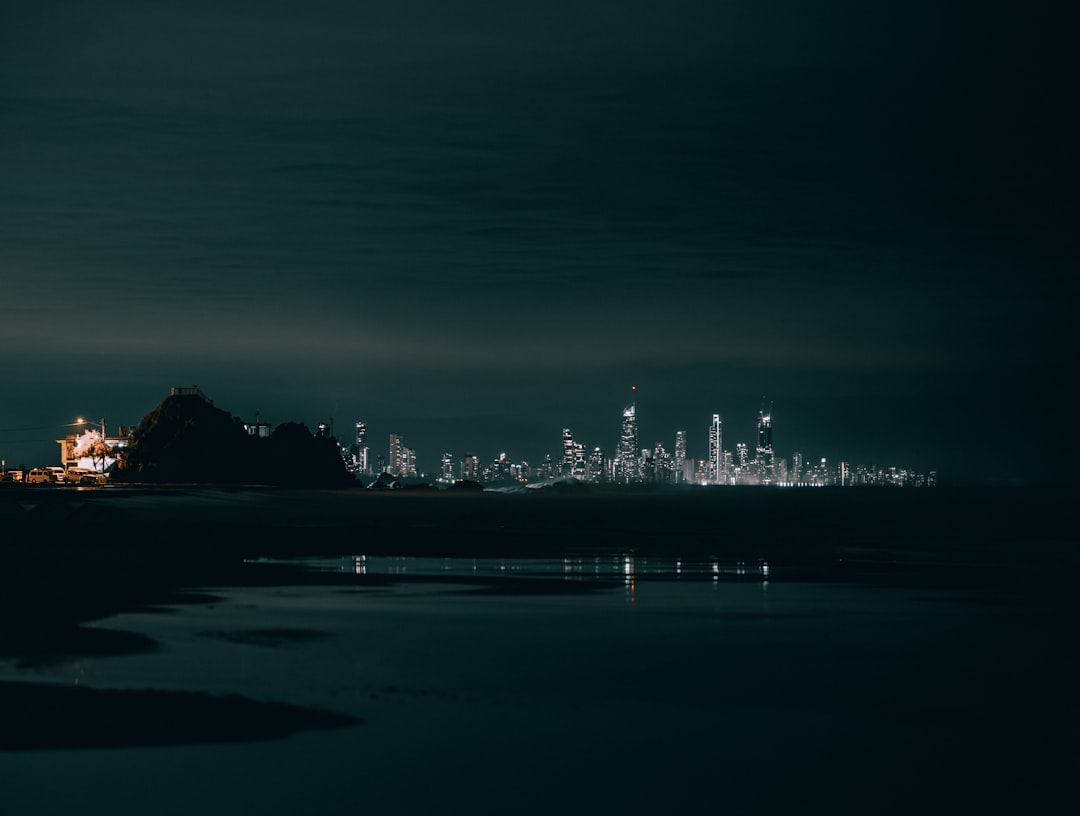 city lights on body of water during night time