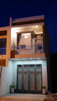 Facade of a contemporary house with large glass windows and clean lines