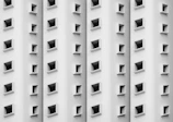 Close-up of the elegant curved windows on Edificio Jiménez's façade.