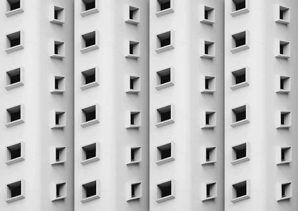 Close-up of the elegant curved windows on Edificio Jiménez's façade.