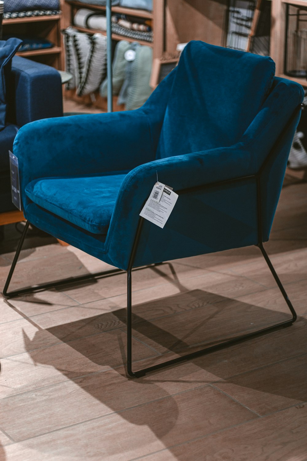 blue and black padded armchair
