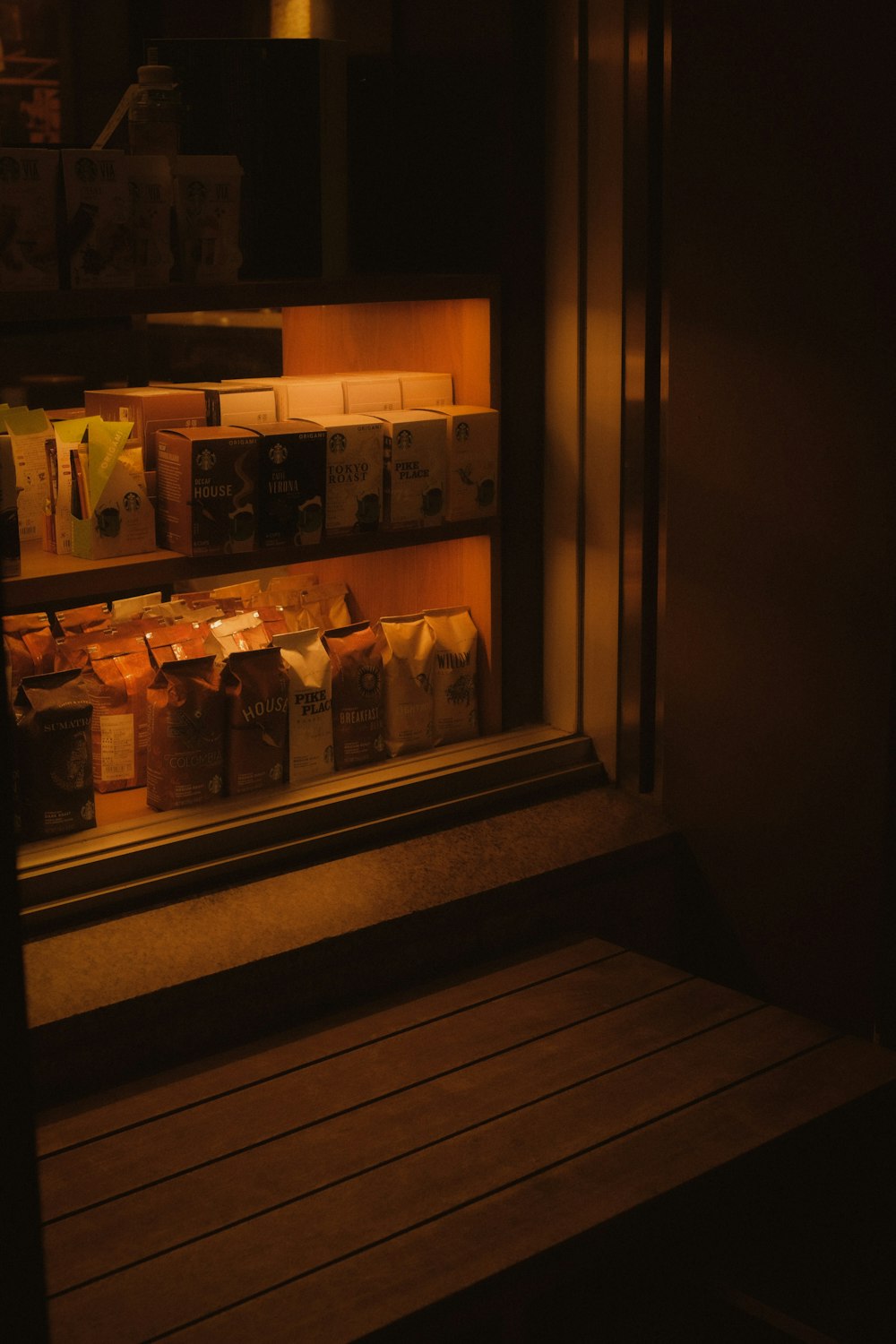 clear glass jars on brown wooden shelf