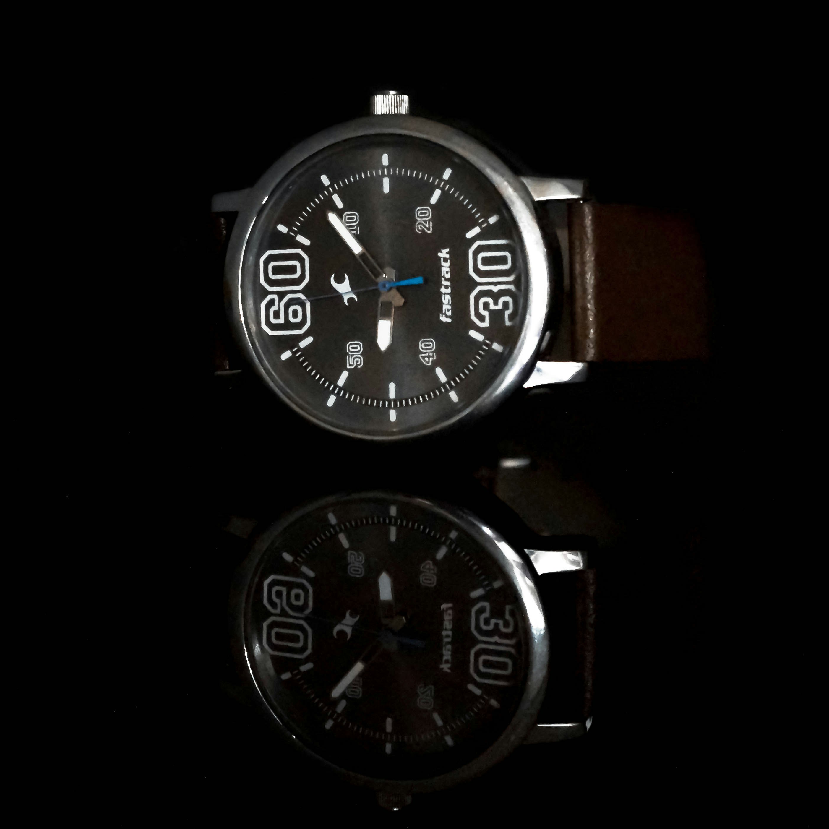 black and silver round chronograph watch