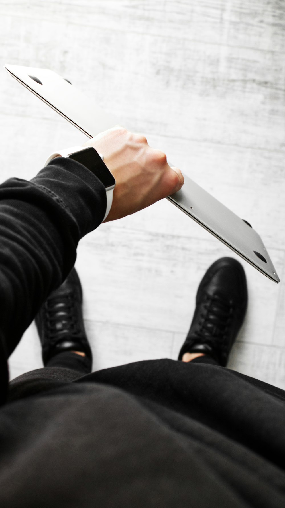 person holding silver kitchen knife