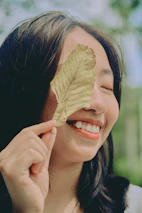 Smiling patient leaving Claravista hospital after a successful eye checkup.