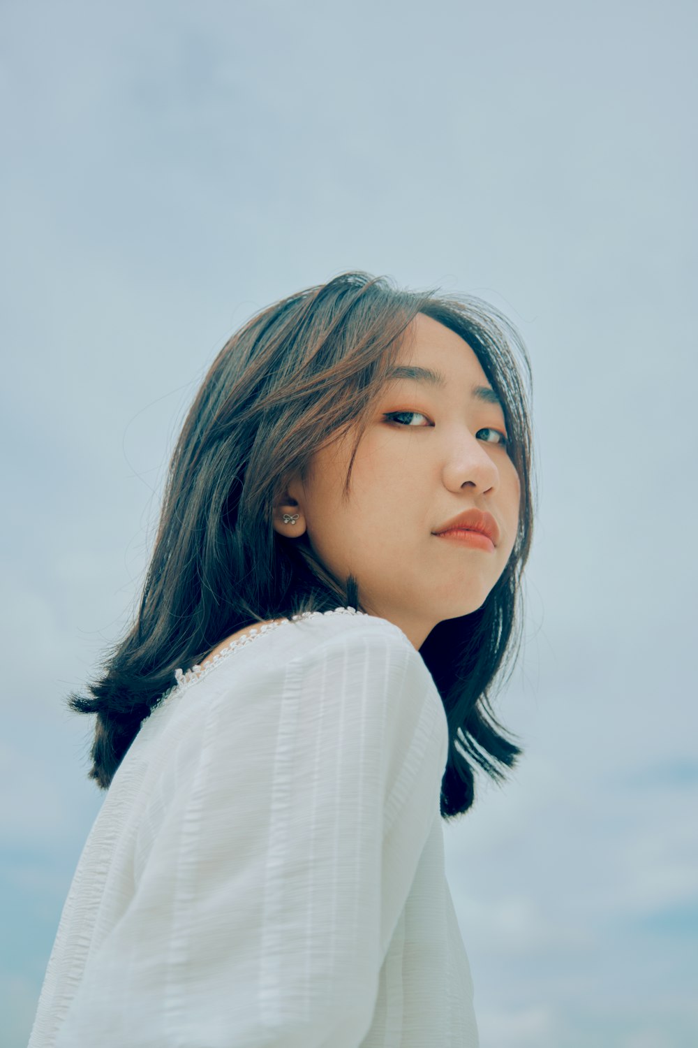 woman in white long sleeve shirt