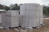 Close-up of concrete blocks neatly stacked at Blometal's storage area.