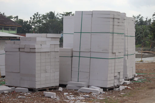 Stacks of sturdy building materials ready for shipment at a warehouse.